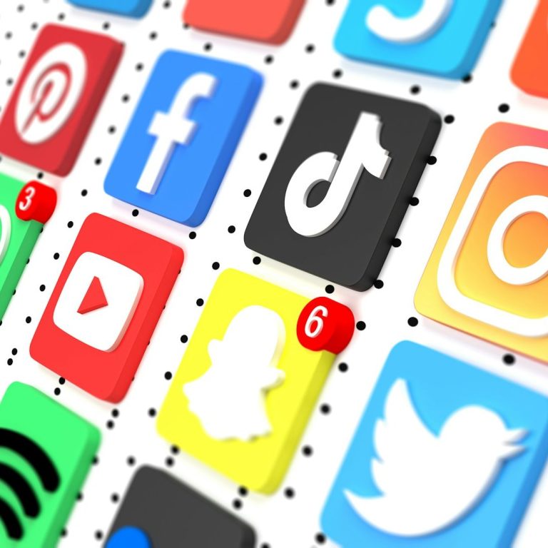Colorful grid of social media icons with notification badges, including TikTok and Snapchat.